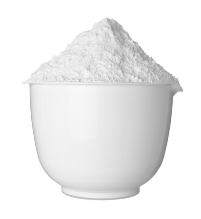 Photo of baking powder in a white bowl, which is a gluten-free additive