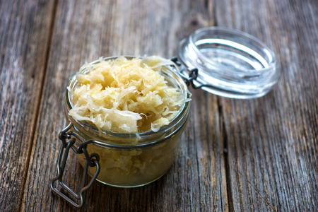 A photo of a jar of homemade sauerkraut, which contains abundant lactobacilli bacteria. The consumption of fermented vegetables are recommended on the paleo autoimmune protocol.