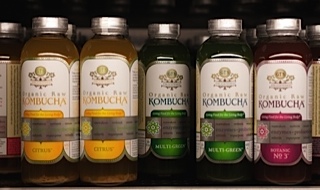 Photo of bottles of kombucha tea on a store shelf. This probiotic beverage is gluten free.