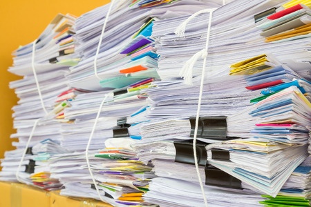 Stacks of paper, representing the Oslo task force's work, which involved evaluating over 300 medical papers for the purpose of creating definitions for terms related to celiac disease